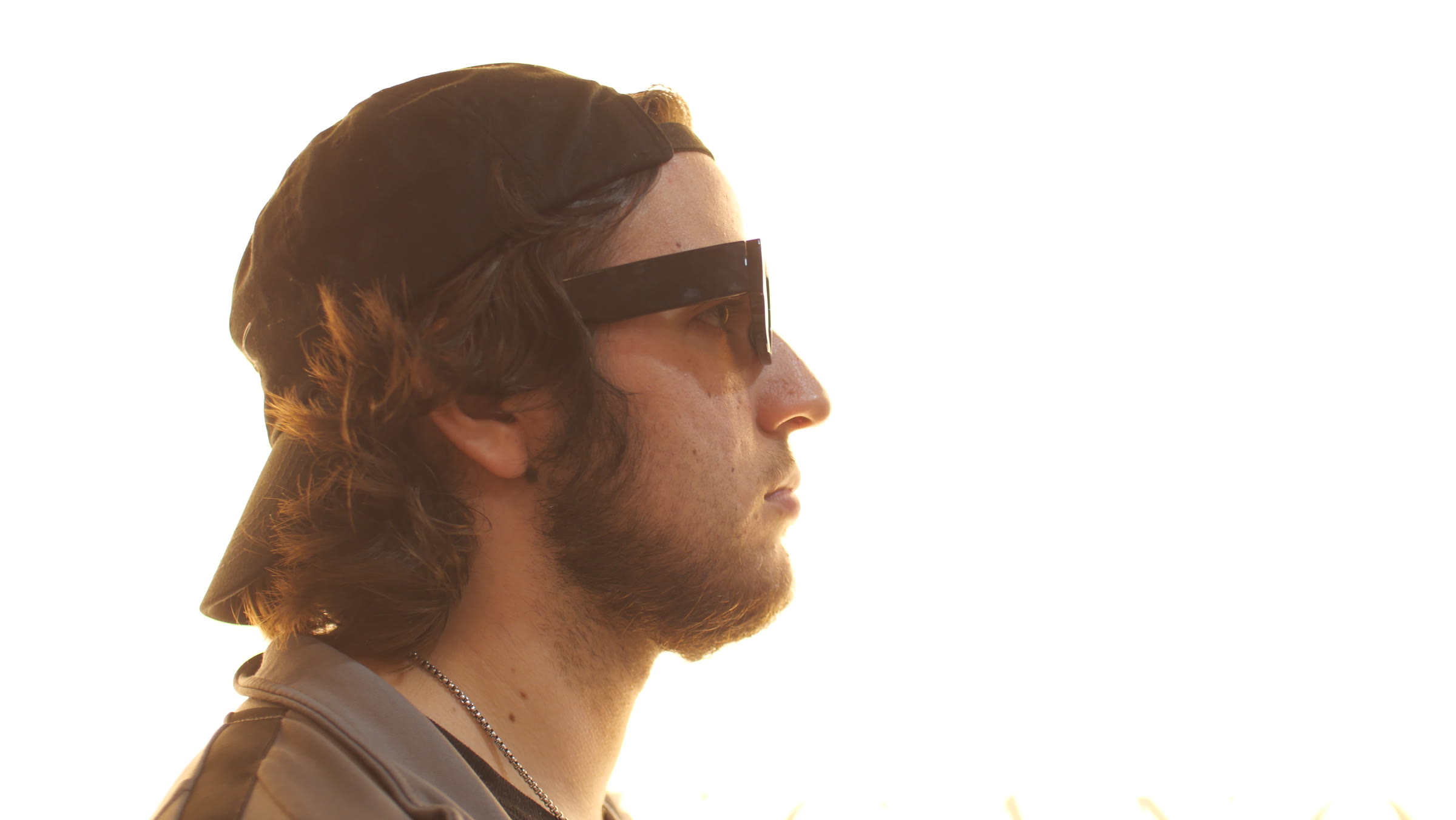 BRB in profile at golden hour against a blown-out sky